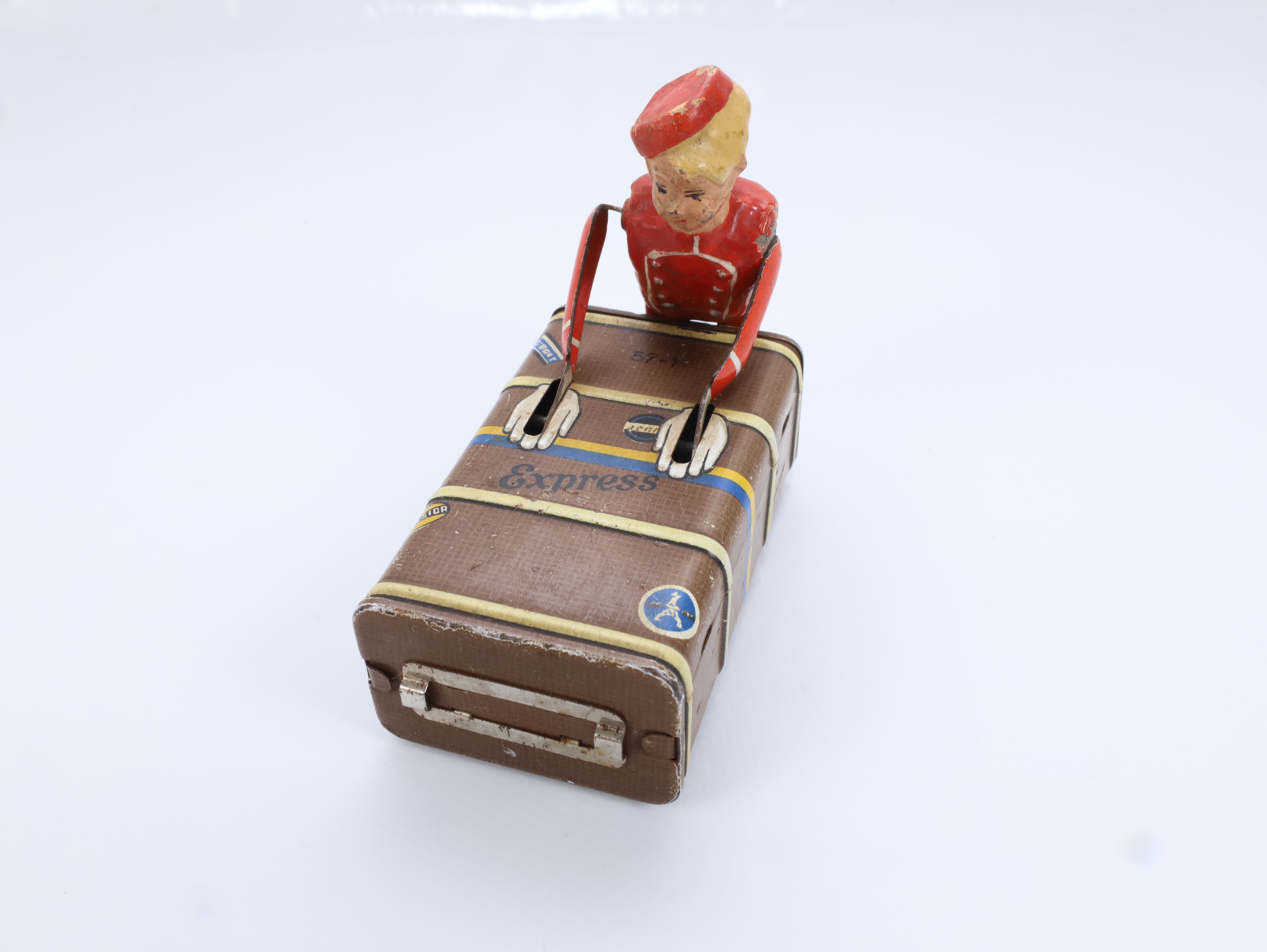 Vintage blikkleke – wind-up bellhop med koffert – Tyskland ca. 1930–50